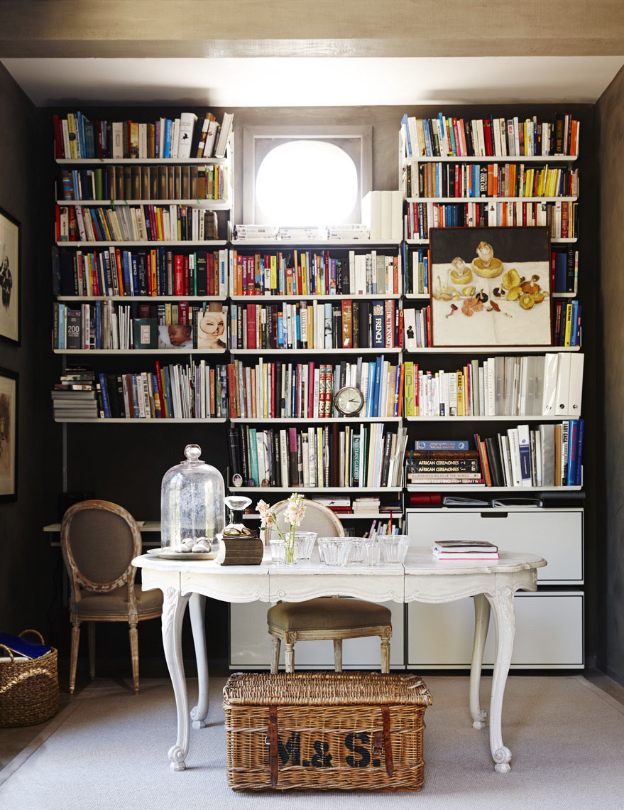 Interior office room in Napa Valley home with white desk books and vintage wicker basket Sean Dagen Photography