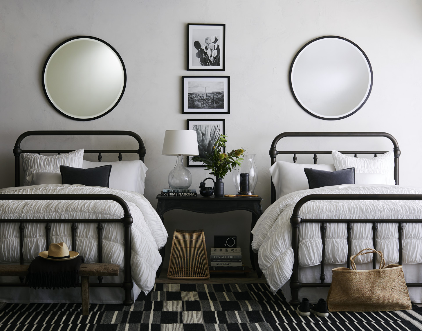 Matching twin beds and mirrors in bedroom
