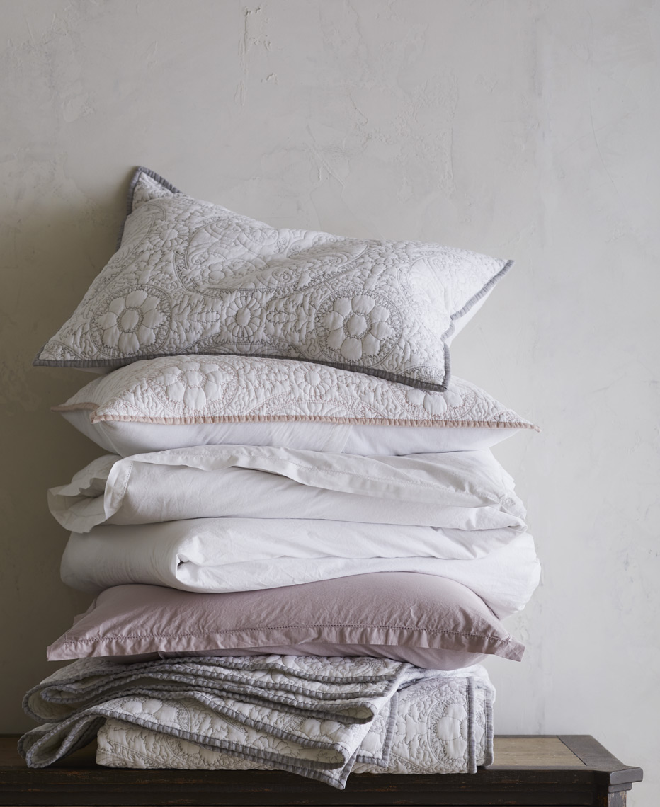 Stack of linens and pillow