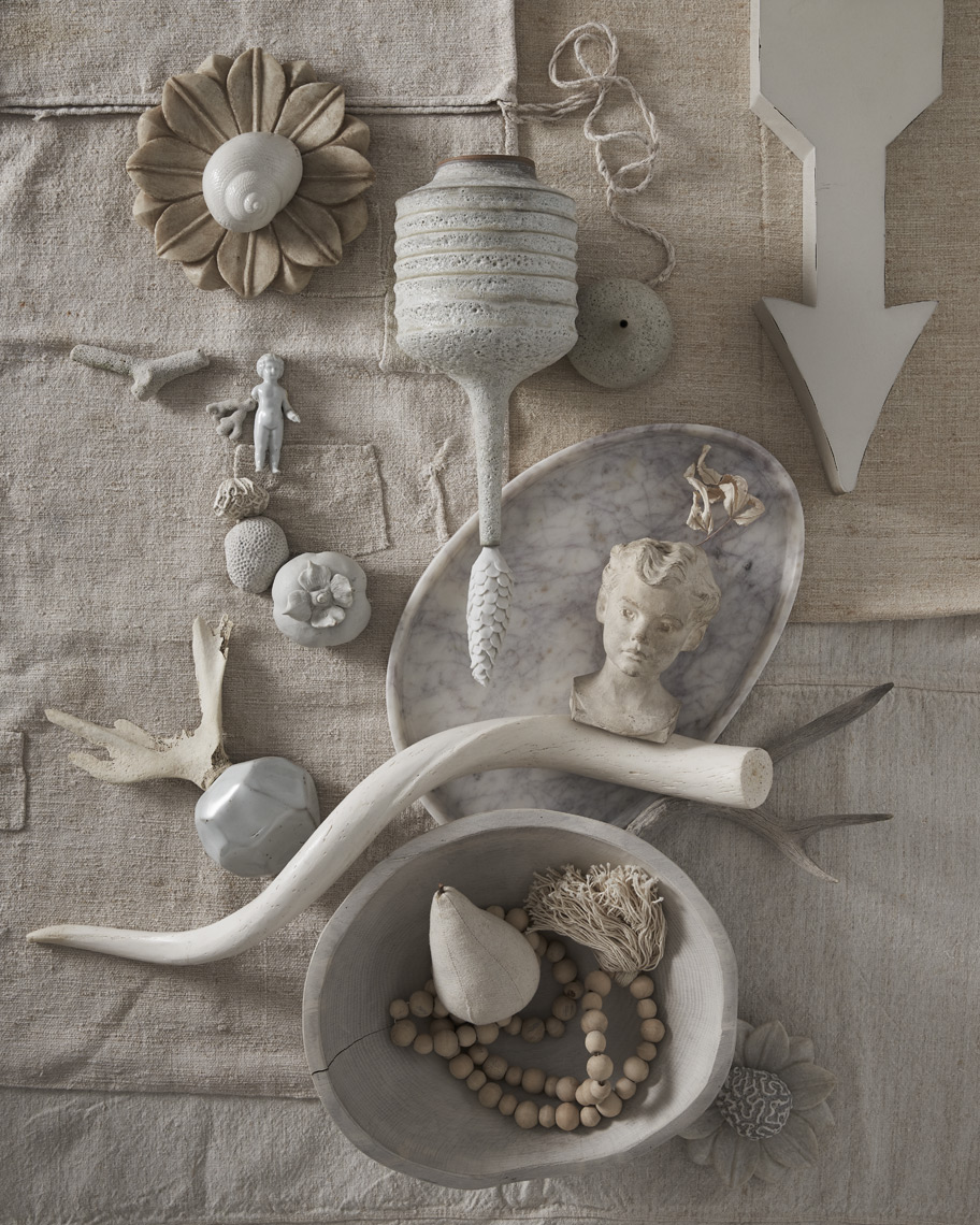 White curios and objects on white linen fabric background Sean Dagen Photography