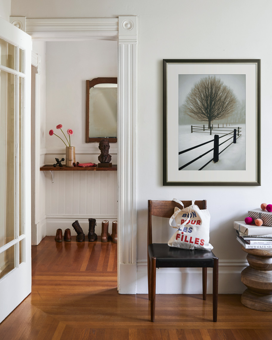 Interior entry way with framed art print on wall chair and side table Sean Dagen Photography
